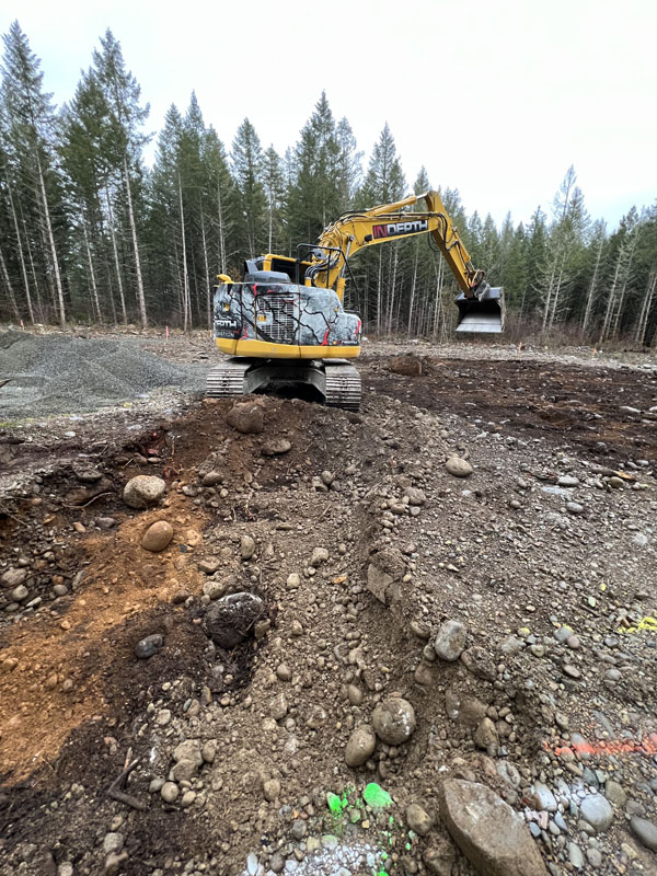 Excavator working on a forest construction site
