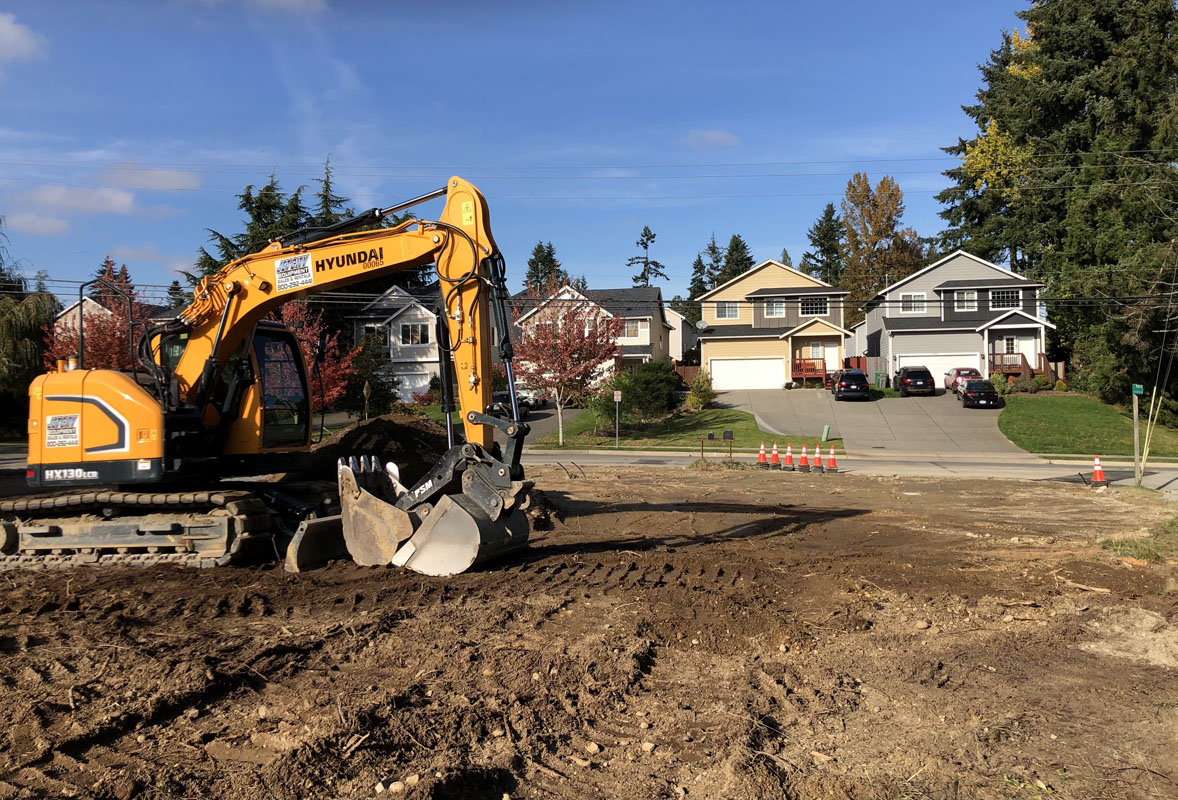 Hyundai excavator at residential construction site
